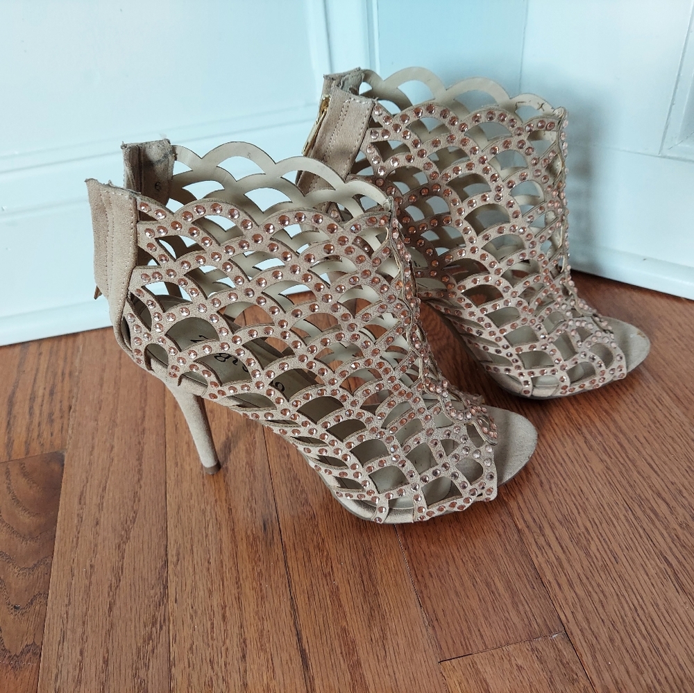 Nude color heels, worn one time.